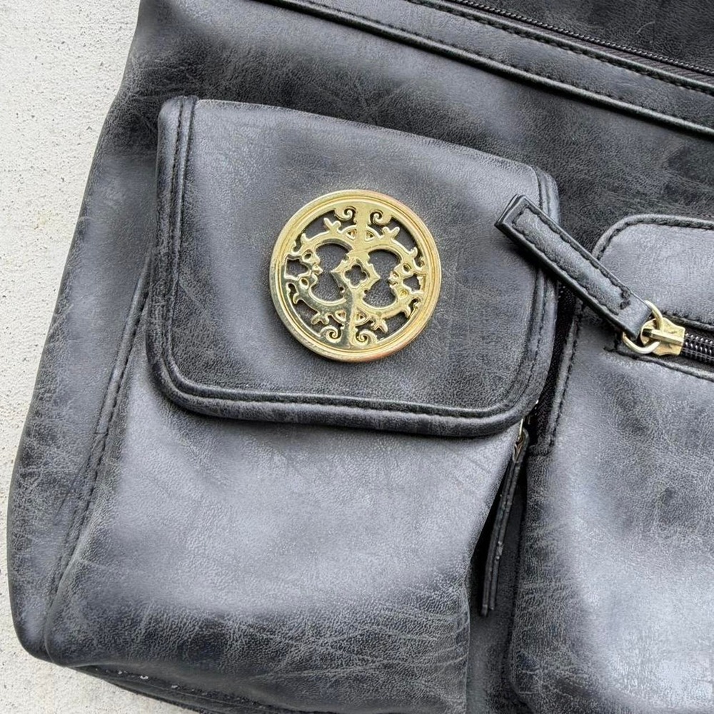 Black leather crossbody bag with gold accents